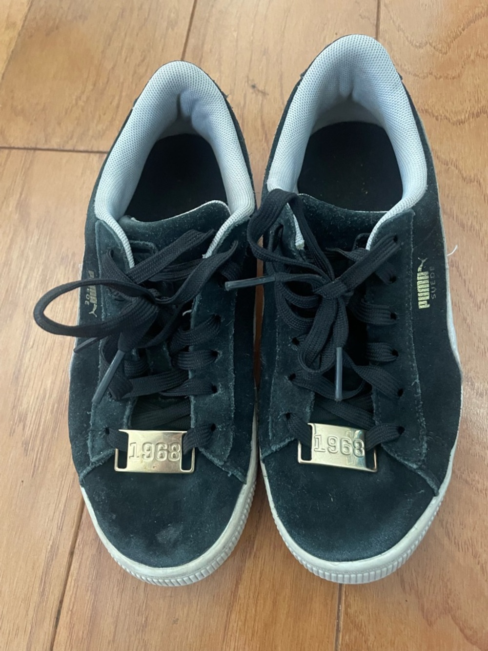 Puma Black Suede Sneakers with Gold Accent